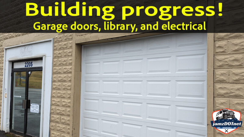 Building progress – garage doors, siding, electrical, and the library!￼